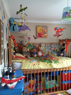 a child's bedroom with winnie the pooh bed and toys on the floor