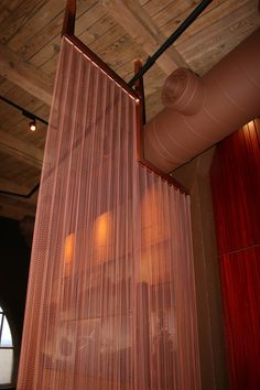 the curtains are hanging from the ceiling in the room