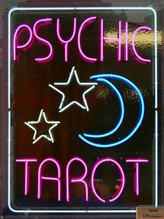 psychic tarot neon sign with stars and crescent