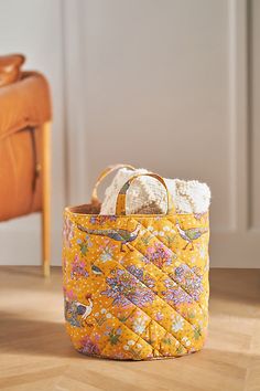 Exclusively at Anthropologie Cotton slub Spot clean Imported | Darby Printed Basket by Anthropologie in Yellow, Cotton Floor Basket, Stackable Wine Racks, Yellow Floor, Anthropologie Home, Unique Cabinets, Iron Candlesticks, Yellow Fits, Fabric Baskets, Wall Mounted Shelves