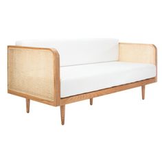 a white couch sitting on top of a wooden frame