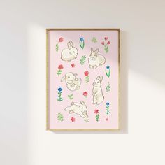 a pink wall with an illustration of rabbits and flowers on it, against a white background