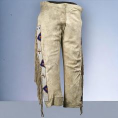 Native Suede Pant-Mens Native American Genuine Suede Leather Fringe Pants Long Beads-Western Beaded Suede Pant-Pantalón de ante nativo Item specifics Closure: Button, Zip Occasion: Casual, Travel Size: 28 in to 48 in Fabric Type: Suede Leather Accents: Fringe Vintage: Yes Department: Men Inseam: 32 in Style: Dress Pants Features: Pockets  Season: Fall, Spring, Summer, Winter Handmade: Yes Pattern: Solid Waist Size: 28 in to 48 in Garment Care: Dry Clean Only Color: Beige Material; genuine Leathe American Indian Clothing, Fringe Pants, Cowboy Pants, Suede Pants, Cowboy Style, Cow Boy, Leather Fringe, Travel Size, Western Wear