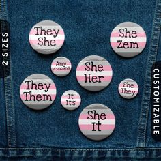 pink and white buttons with the words they she, then it