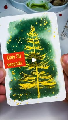 someone holding up a card with the words only 30 seconds written on it and a painting of a pine tree