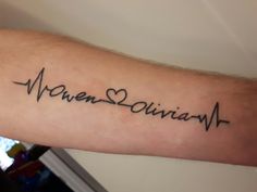 a person with a tattoo on their arm that says, raven & juliann in cursive writing