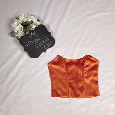 Fashion Nova Medium Corset Top Orange 95% Polyester 5% Spandex Satin-Like Never Worn With Tag Intact Chic Fitted Orange Crop Top, Orange Fitted Top For Party, Fitted Satin Casual Top, Fitted Orange Party Tops, Fitted Orange Top For Night Out, Casual Fitted Satin Top, Fitted Solid Satin Tops, Fitted Satin Tops In Solid Color, Fitted Solid Color Satin Tops