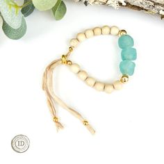 This unique adjustable bracelet is a beauty! The sea glass and wood beads give off the perfect vibe for spring and summer! The bracelet is adjustable and can be worn up to an 8" wrist. Adjustable Bracelet, Wood Beads, Sea Glass, The Sea, Wood, Glass, Beauty