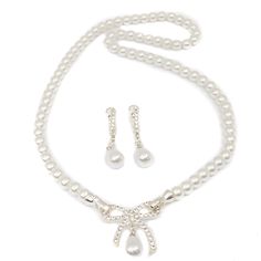 16"L Single strand of delicate 6mm pearls with rhinestone bow pendant accent. Clasp is on either side of 25mm bow. Includes a matching pair of elegant huggie hoop drop earrings. Pearl Choker Set, Bridal Pearl Jewelry, Pearl Necklace Bridal, Pearl Jewelry Set, Bow Pendant, Pearl Bridal Jewelry, Pearl Necklace Earrings, Pearl Jewelry Sets, Necklace Bridal