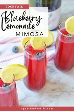 three glasses filled with blueberry lemonade mimosa