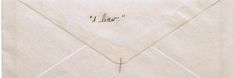 an envelope with writing on the front and bottom flap, inside which is marked'i dear '