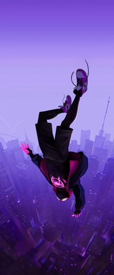 a man flying through the air on top of a purple and black spiderman suit