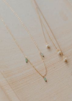 We’re in our Color Era and we’re vibing hard with these colorful stones right now. Gemma Trio is inspired by our Quinate Necklace, just a more colorful version! Three 2x4mm stones drop from our delicate cable chain. Necklace measures 17" + 1" extender. Available in Moss (African Green Jade) + Seafoam (Green Aventurine) + Ash (Black Labradorite). Available in 14kt Gold Fill + Sterling Silver. Shop the entire Gemma Collection. Handmade in Eau Claire, WI. Our jewelry is handmade so each piece will Trio Necklace, Copper Uses, Everyday Wear Jewelry, Colorful Stones, Black Labradorite, Cable Chain Necklace, Silver Shop, Green Jade, Jewelry Cleaner