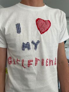 a man wearing a t - shirt with the words i love my boyfriend written on it