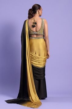 Black and yellow crepe satin silk pre-draped saree with pleated drape. Paired with padded  V Neck blouse with all chevron pattern sequin embroidery.
Components:2
Pattern:Embroidered
Type of Work:Sequin Work
Neckline:V Neck
Sleeve Type:Sleeveless
Fabric:Saree: Satin Silk, Blouse: Crepe Silk
Color:Black,Yellow
Other Details:
Deep U back
Bead tassels hem on blouse
Embroidered waistband
Note: Kindly connect with customer service team to customize blouse sleeve
Occasion:Sangeet,Cocktail - Aza Fashion Elegant Yellow Silk Pre-draped Saree, Elegant Yellow Blouse For Evening, Elegant Yellow Evening Blouse, Yellow Silk Blouse Piece For Party, Yellow Silk Party Blouse Piece, Yellow Pre-draped Party Saree, Yellow Silk Blouse For Party, Elegant Yellow Pre-draped Saree For Party, Pre-draped Silk Blouse For Party