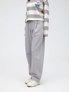 Details: Spotted grey sweatpants with a touch of blues Combination of elasticated waistband and large pleats Relaxed fit Materials & Care: Polyester fibre 52.9%Cotton 44.7 %Spandex 2.4% Hand wash | Dry clean Do not bleach Size & Fit: Model is 5'7", Bust 32, Waist 24, Hips 35, wearing a size S Item #: LN1PA06 Gray Pants With Ribbed Waistband For Fall, Gray Fall Pants With Ribbed Waistband, Fall Gray Pants With Ribbed Waistband, Gray Loungewear Pants With Elastic Cuffs, Gray Sweatpants With Ribbed Waistband For Spring, Gray Pants With Ribbed Cuffs For Fall, Gray Bottoms With Elastic Cuffs And Relaxed Fit, Gray Relaxed Fit Pants With Elastic Cuffs, Gray Straight Sweatpants With Elastic Waistband