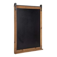 a wooden framed chalkboard hanging on a wall with metal fittings to hold it in place