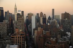 an aerial view of the city skyline at sunset