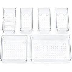 six clear plastic trays with holes on the side and bottom, each containing four different sized