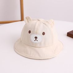 Get Ready for Adorable Adventures with Our Lovely Kids Bear Decor Panama Bucket Hat! Introducing our Kids Bear Decor Panama Bucket Hat a charming and practical addition to your little one's wardrobe. Crafted from a blend of soft cotton and durable polyester, this cartoon-themed Hat is designed to keep your child comfortable and stylish throughout the day. Product Features: Material: Cotton/Polyester blend Head circumference: Approximately 48CM Recommended age: Suitable for 6-24 months Top Type: Dome Feature: Multifunctional Applicable Scene: Casual Applicable Season: Four Seasons Gender: Unisex This adorable Hat features lovely bear ears that add a playful touch to your child's outfit. The breathable fabric ensures optimal comfort, making it ideal for outdoor adventures, picnics, beach day Baby Bucket Hat, Cap Baby, Girls Sun Hat, Kids Sun Hat, Ear Cap, Ear Design, Baby Sun Hat, Bear Decor, Dad Baby