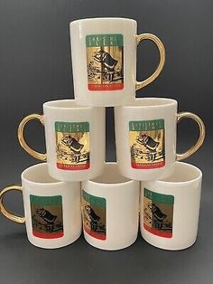 six coffee mugs stacked on top of each other