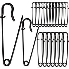 several pairs of scissors and hooks on a white background