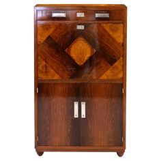 a wooden cabinet with two doors on the front and one door open to reveal an interesting design