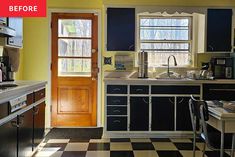 a kitchen with black and white checkered flooring, yellow walls and wooden door