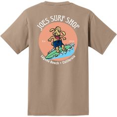 Kick back with the laid-back vibe of the beach with the Joe's Surf Shop Teddy The Surfing Dog Heavyweight Pocket Tee. Made from soft, durable cotton, this tee is all about comfort and easy style. The back features a fun graphic of Teddy, the surfing dog, catching some waves and spreading good vibes, perfectly capturing the spirit of Joe's Surf Shop. With a handy front pocket for stashing small essentials, this tee is as practical as it is cool. Whether you're lounging on the sand, catching some Graphic Print Crew Neck T-shirt For Surfing, Relaxed Fit Surfing T-shirt With Graphic Print, Vacation Surfing T-shirt With Graphic Print, Graphic Tee T-shirt With Front Print For Surfing, Cheap Surfing T-shirt With Front Print, Graphic Tee Soft-washed T-shirt For Surfing, Laguna Beach California, Surf Lifestyle, Dogs Tee