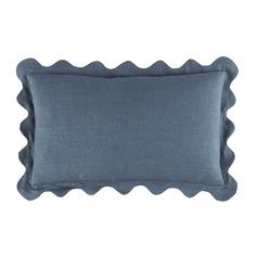 a blue pillow with scalloped edges