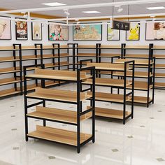 an empty classroom with wooden shelves and pictures on the wall