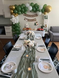 a long table with plates and cups on it