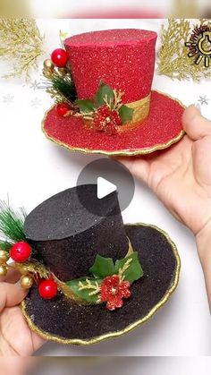 two hats with holly decorations on them are being held by someone's hands,