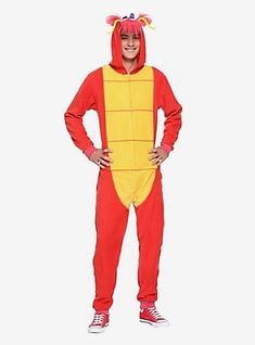 a man in a red and yellow costume standing with his hands on his hips while wearing a dragon costume