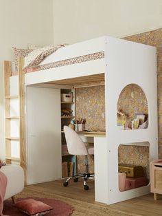 a white loft bed with desk underneath it