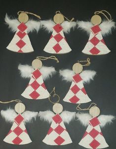 twelve red and white christmas tree ornaments with angel wings on black background, set of six