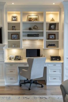 a home office with built - in shelving, desk and chair is lit by recessed lighting