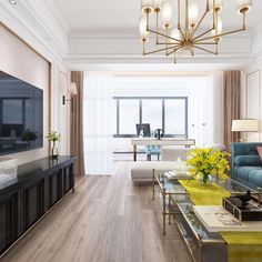 a living room filled with furniture and a flat screen tv on top of a wooden table