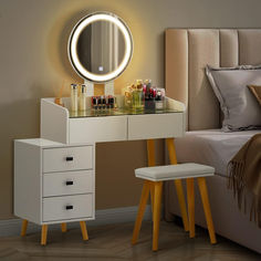 a bedroom with a vanity, mirror and stool