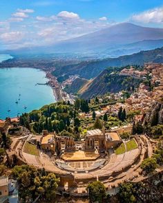 an aerial view of the roman amphit and its surrounding area, with mountains in the background