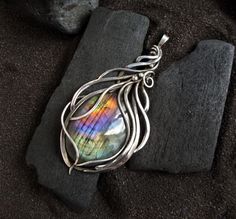 Elven style labradorite necklace with a beautiful finnish spectrolite of a beautiful rainbow color. Silver pendant - a wonderful gift to your wife, daughter, mother, sister!  * * * *  Labradorite - stone of love and fulfillment of desires! This mineral will help to discover the purpose, to show the talents inherent in nature, parents, to climb the career ladder, to fulfill the innermost desires, to find love. The product is patinated and polished. silver, labradorite Size: 5,5  cm (2.16) * * * * Iridescent Labradorite Pendant Necklace, Iridescent Labradorite Pendant Jewelry, Handmade Iridescent Labradorite Necklace, Iridescent Labradorite Necklace For Gift, Gift Iridescent Labradorite Necklace, Elven Style, Elven Necklace, Career Ladder, Rainbow Moonstone Necklace