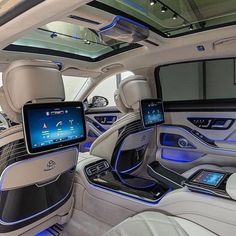 the interior of a car with electronic gadgets on it's dash boards and seats