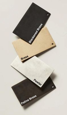 three different types of metal tags on top of each other with the words brass, power and