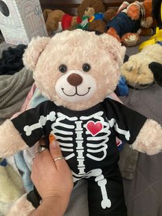 a teddy bear with a skeleton shirt on