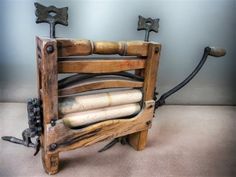 an old chair made out of wood and iron