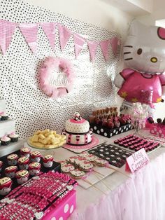 a hello kitty birthday party with pink and black decorations