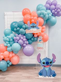 the balloon wall is filled with balloons and an image of stitcher from stitchers