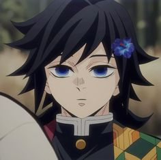 an anime character with blue eyes and black hair