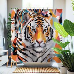 a shower curtain with a tiger on it's face next to a potted plant