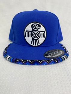 You are viewing a hand-beaded baseball hat with thunderbird patch. The hat is ADULT size. All beads are sewn by hand.  All patches are applied by hand. No two hats are exactly alike and will never be replicated exactly. Made by an indigenous artist, I am an enrolled member of the Jumano Nation of West Texas. Free shipping to US locations only Traditional Adjustable Snapback Baseball Cap, Traditional Adjustable Snapback Hat, Adjustable Flat Bill Snapback Hat For Festival, Festival Snapback Hat With Flat Bill, Metis Beadwork Patterns, Metis Beadwork, Bead Hat, Beaded Hats, Hat Burning